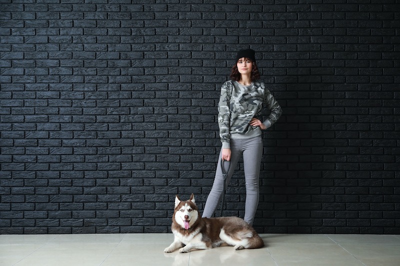 Young woman with her cute dog near dark brick wall Get everything your site needs, including free SSL for life, faster load times, one-click WordPress staging and installs, and North American-based customer support agents available 24/7 by chat or ticket.
